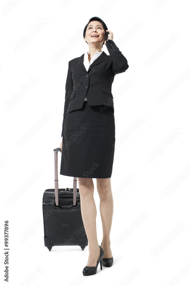 Cheerful businesswoman on a trip making a phone call Cheerful businesswoman on a trip making a phone call