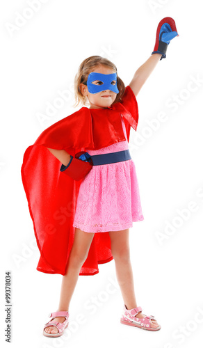 Superhero little girl poses...