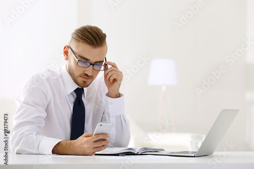 Businessman working with la...