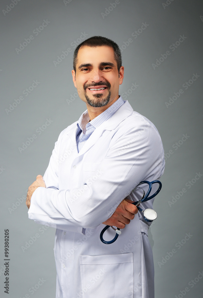 Portrait of a doctor on grey background Portrait of a doctor on grey background
