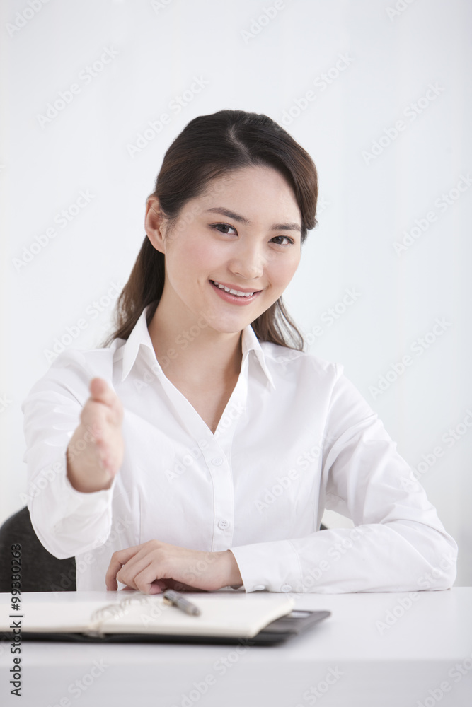 Young businesswoman pointing the front Young businesswoman pointing the front