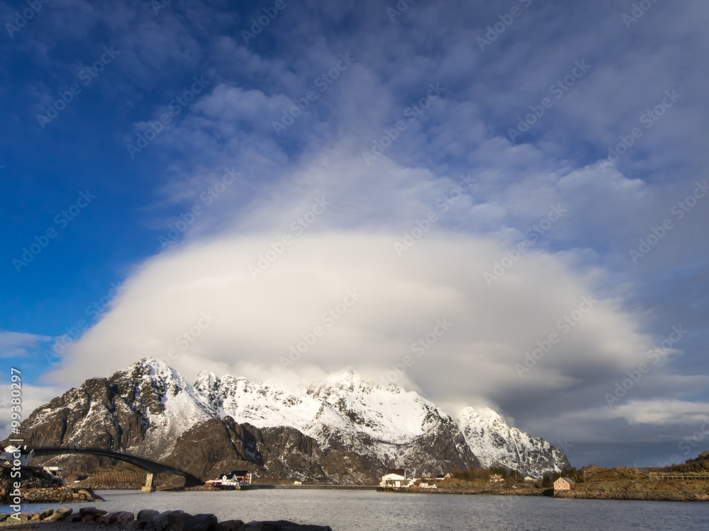 Winter panorama with big cloud over mountains in Henningsvaer on Lofoten Islands, Norway
