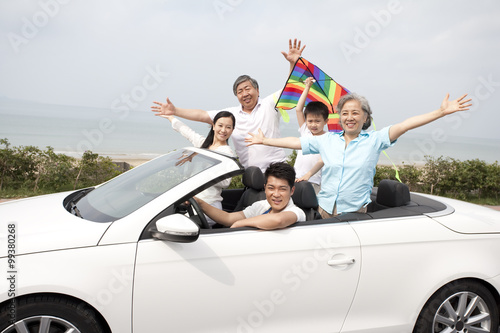 Happy Family Driving in a Convertible