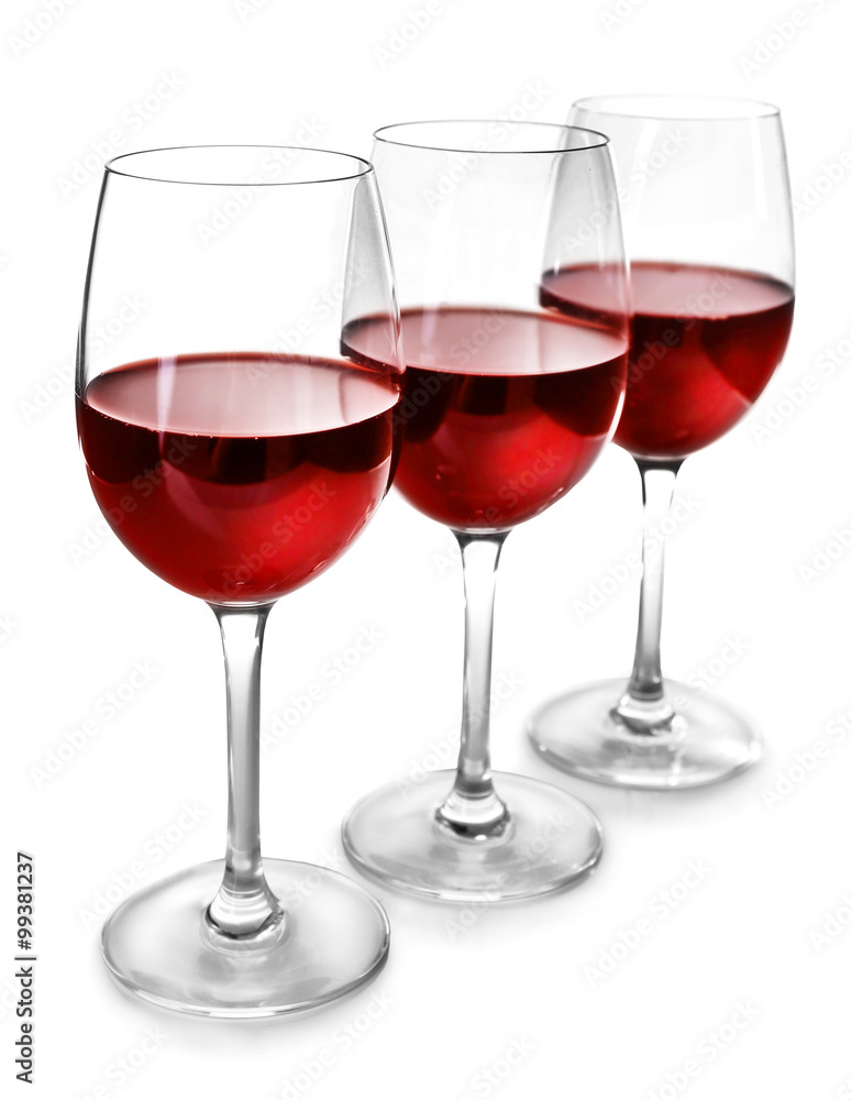 Three glasses of red wine on light background Three glasses of red wine on light background