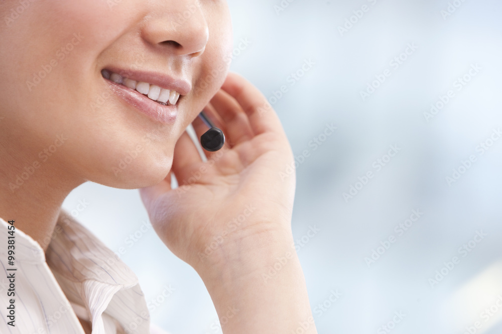 Close-up of call center agent's hand and mouth Close-up of call center agent's hand and mouth