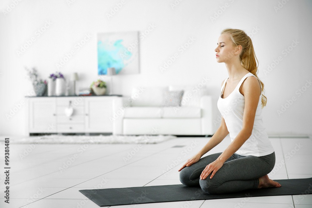 Young attractive woman do yoga exercise in the room Young attractive woman do yoga exercise in the room