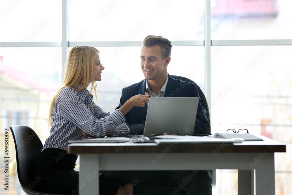 Businessman and businesswoman working in office Businessman and businesswoman working in office