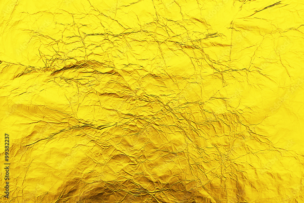 Golden crumpled foil background Golden crumpled foil background