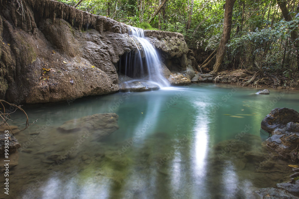 tropical waterfall in deep forest of Kanchanaburi province, Thailand. tropical waterfall in deep forest of Kanchanaburi province, Thailand.