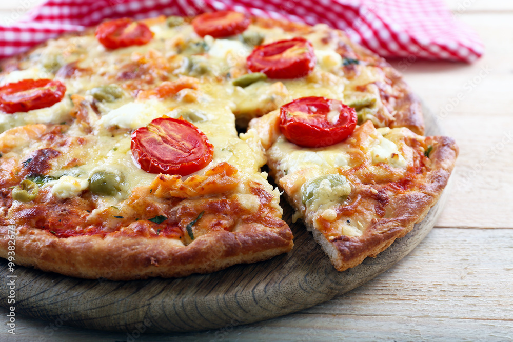 Delicious tasty pizza with cut slice, closeup Delicious tasty pizza with cut slice, closeup