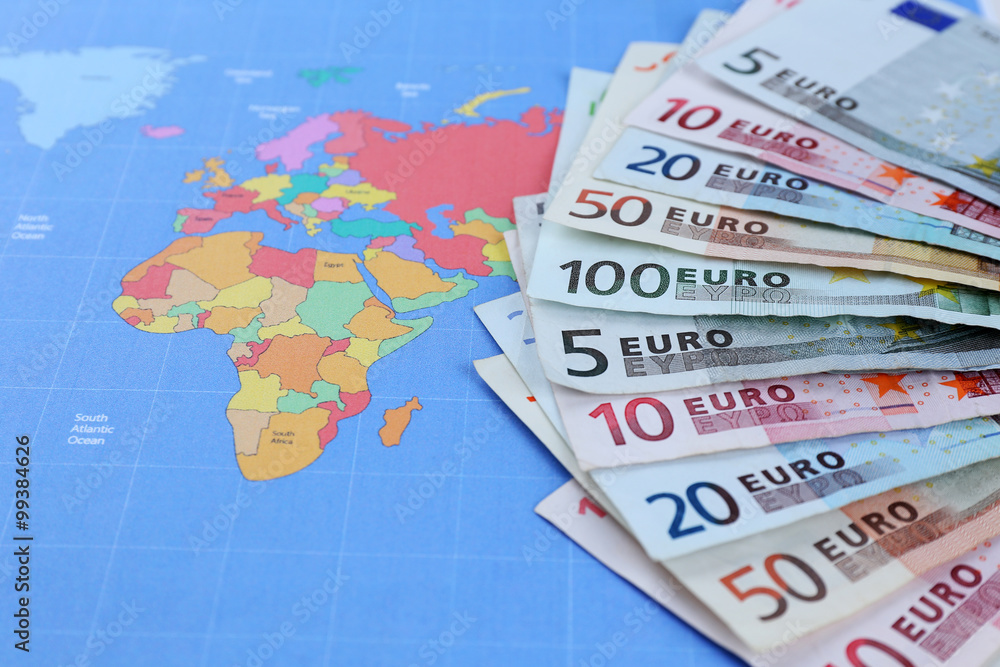 Different euro banknotes on a map background Different euro banknotes on a map background