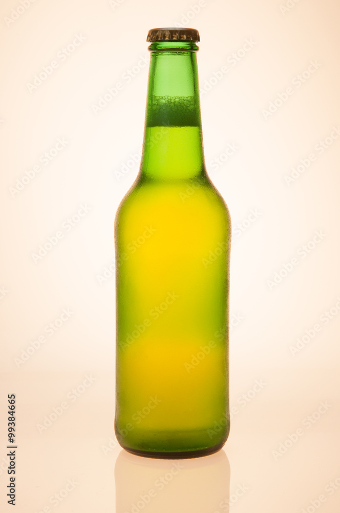 Backlit Green Beer Bottle With Yellowish Glow On White Background