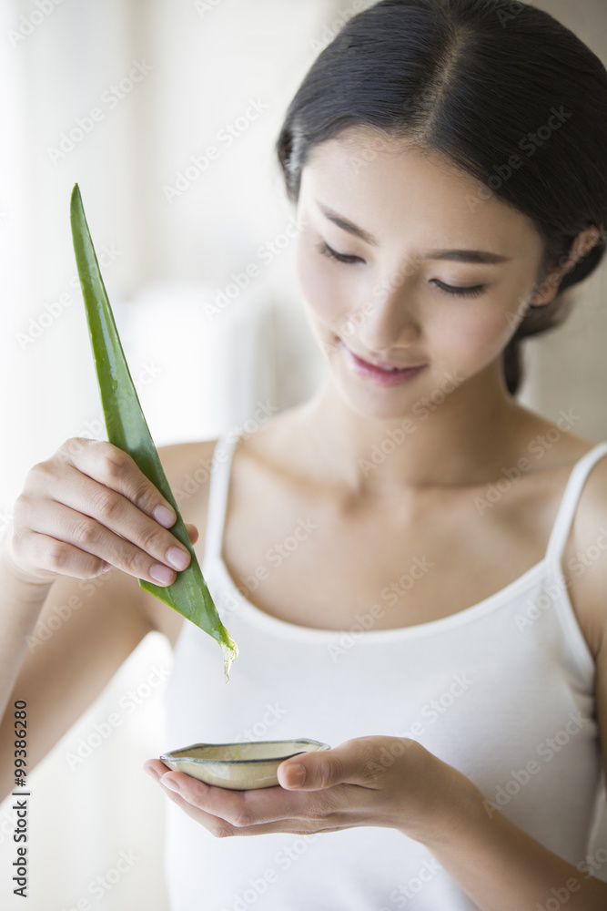Young woman with natural aloe vera Young woman with natural aloe vera