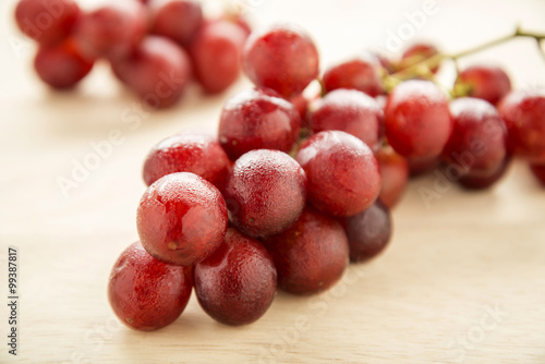 fresh bunch of grapes on wooden background