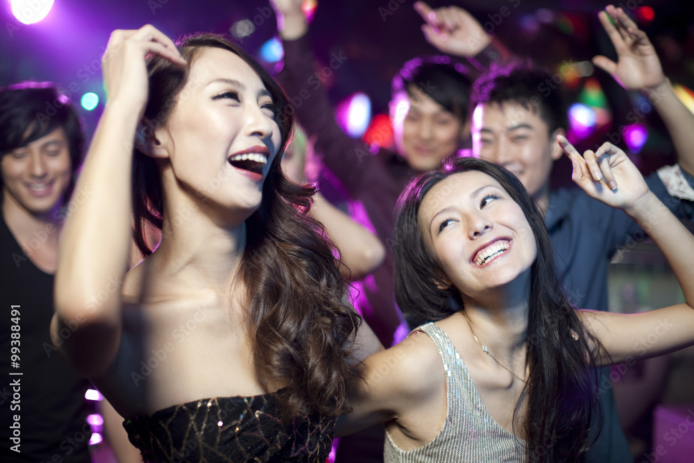 Stylish young people dancing in nightclub Stylish young people dancing in nightclub