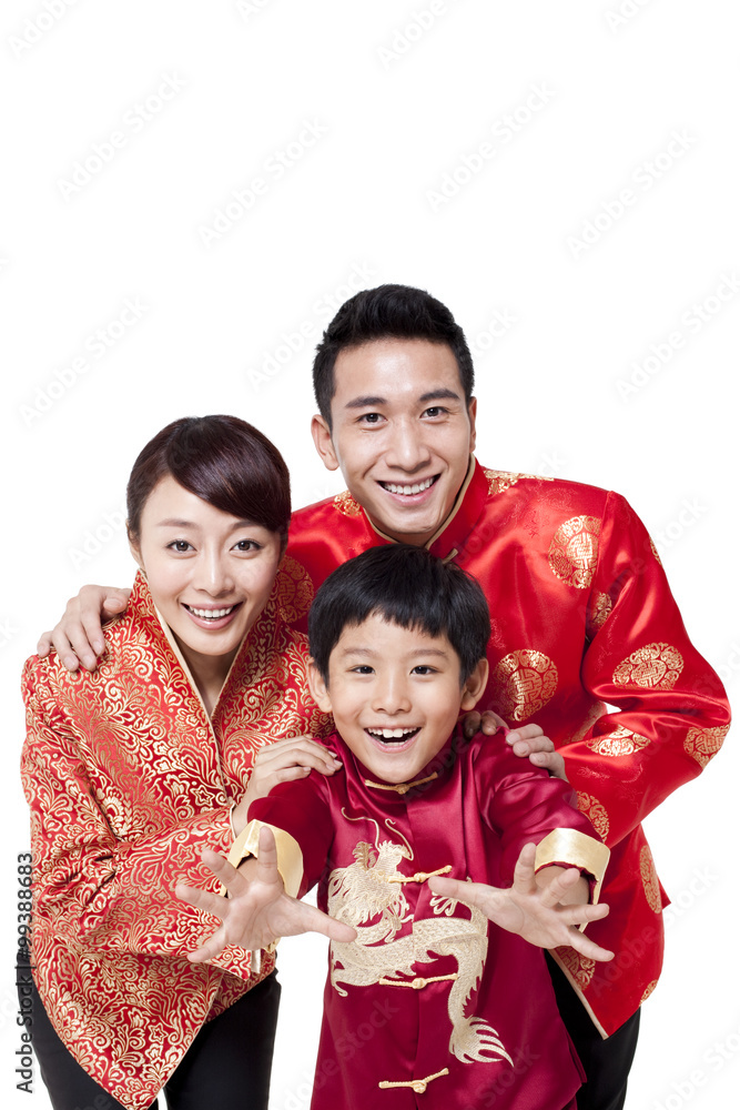Family Dressed in Traditional Clothing Celebrating Chinese New Year Family Dressed in Traditional Clothing Celebrating Chinese New Year