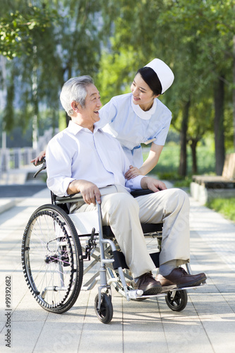 Nurse with wheelchair bound patient © Blue Jean Images
