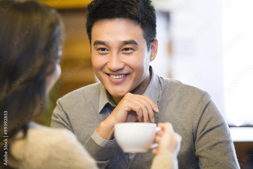 Young couple chatting in cafe