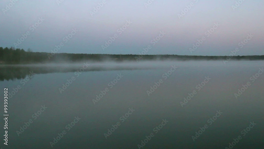 Foggy river in early morning with full moon Foggy river in early morning with full moon