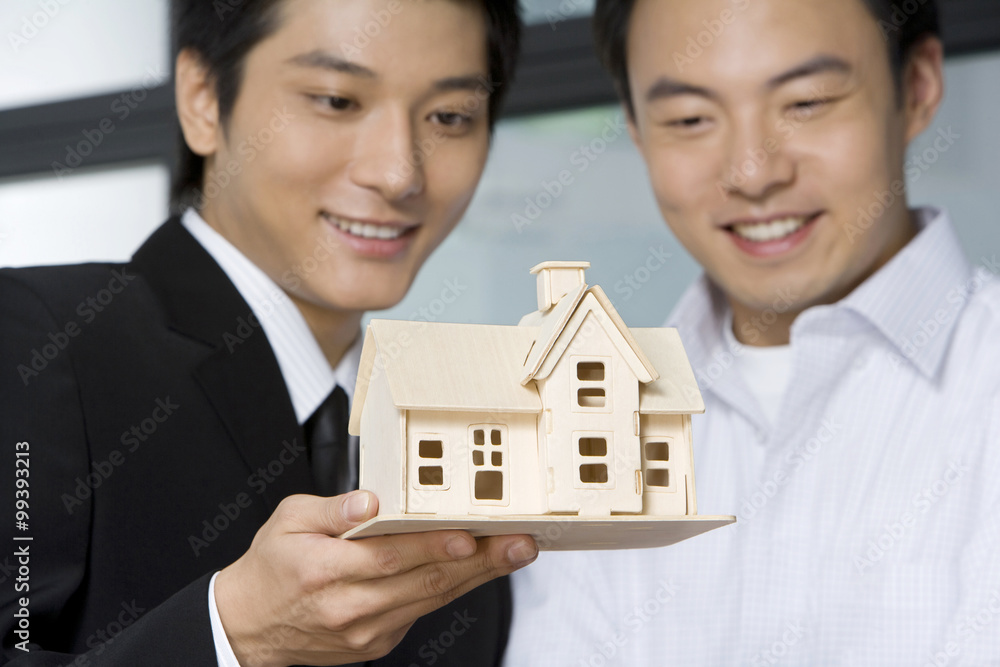 Real estate agent selling a house to customer