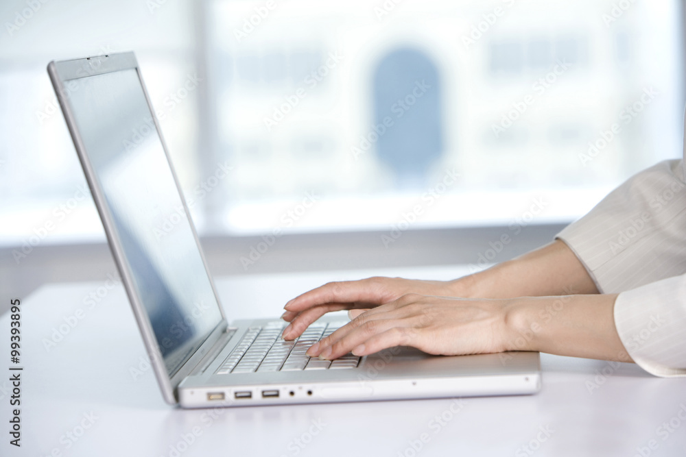 Office worker using her computer Office worker using her computer