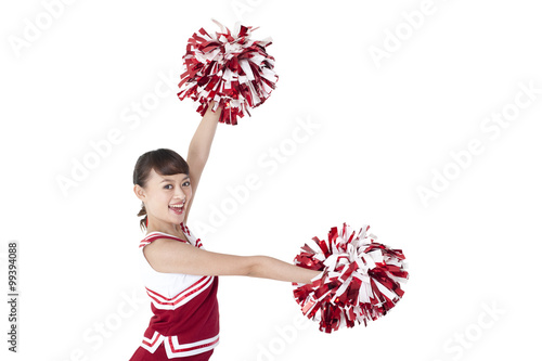 Billede på lærred Cheerleader in action with her pom-poms