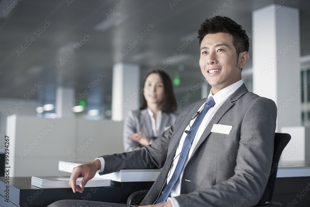 Business person sitting in office Business person sitting in office