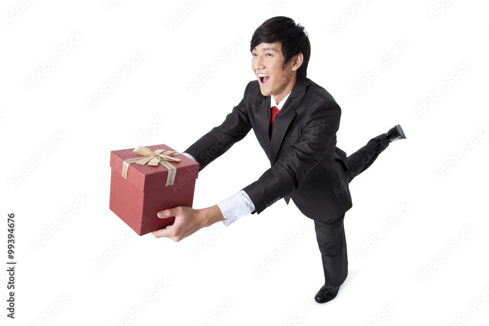 Excited Businessman Holding a Gift Excited Businessman Holding a Gift
