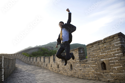 Photography Happy businessman on the Great Wall