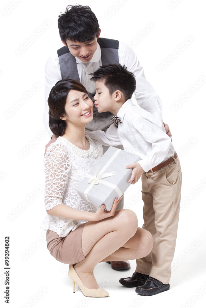 Happy young family sending gift and kissing Happy young family sending gift and kissing