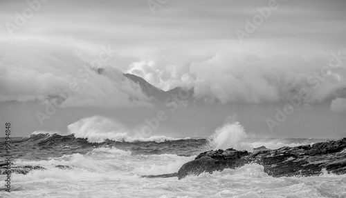 Sea landscape. An morning, Clouds sky and mountains. Black and white photo