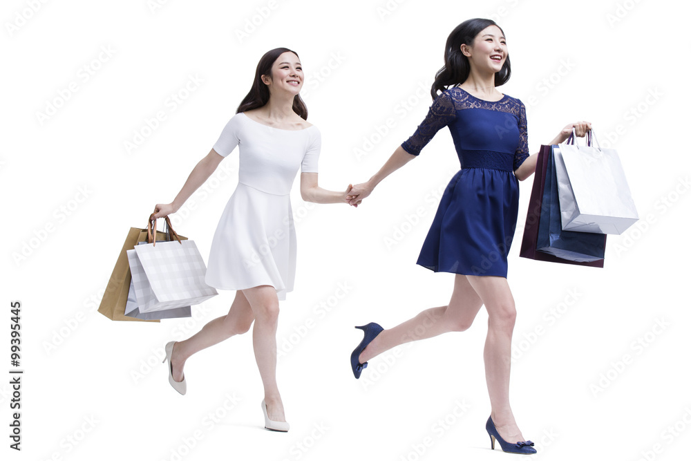 Cheerful female friends shopping