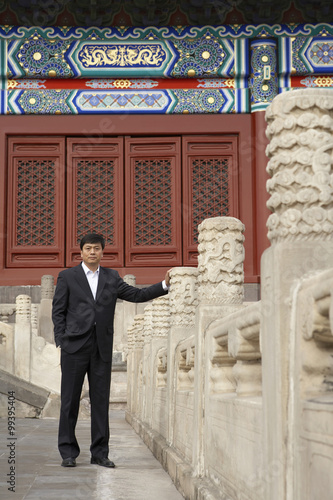 Businessman Standing In The Forbidden City In Beijing photo