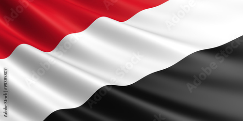 Fotografie Flag of Yemen waving in the wind.