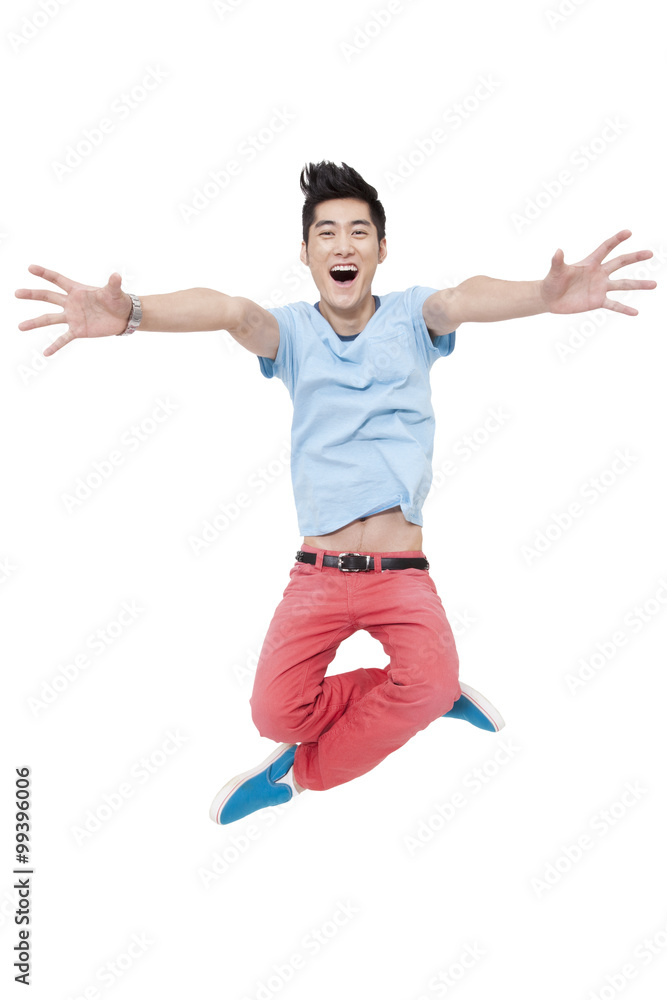 Happy young man jumping