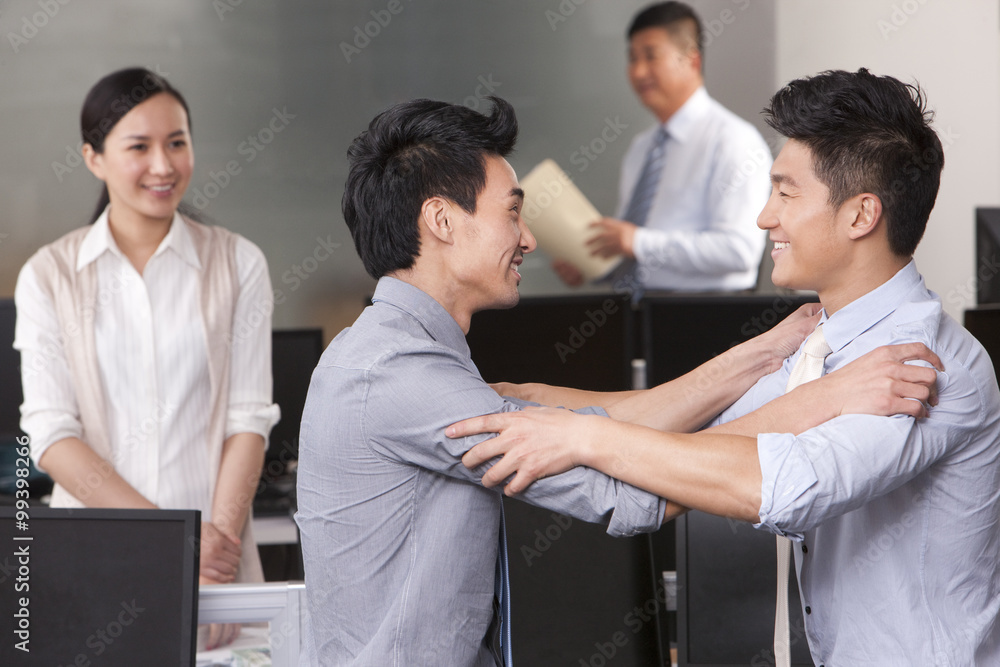 Businessmen with their hands on each other's shoulders Businessmen with their hands on each other's shoulders