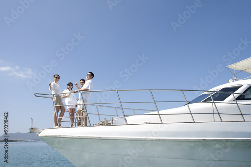 Friends Drinking Champagne on a Yacht © Blue Jean Images