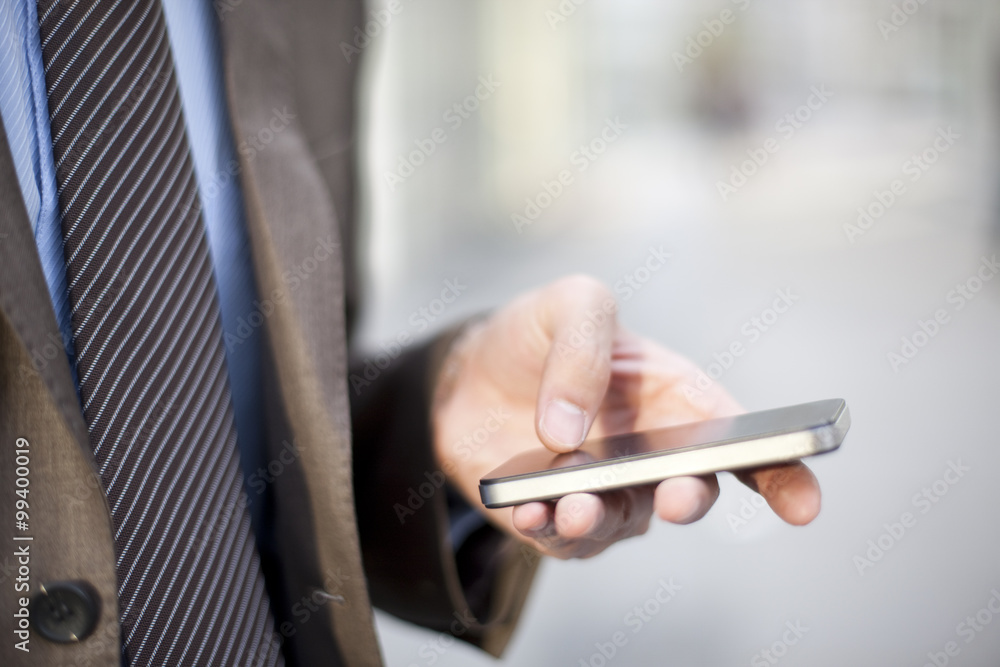 Young businessman and cellphone Young businessman and cellphone