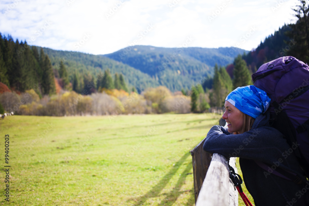 The girl with the backpack resting.