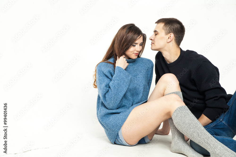 Portrait of happy couple isolated on white background. Attractive man and woman being playful.
