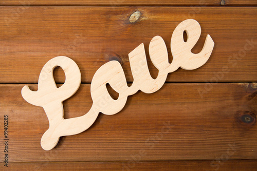 close up of word love cutout on wood