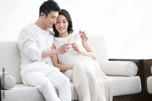 Cheerful young couple with champagne