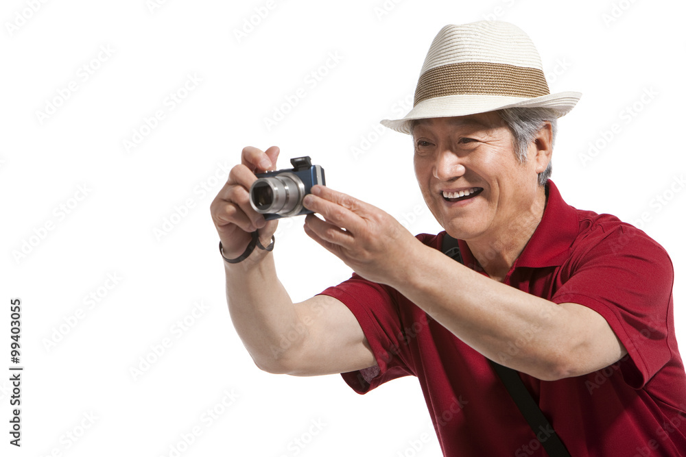 Portrait of senior man holding a camera Portrait of senior man holding a camera
