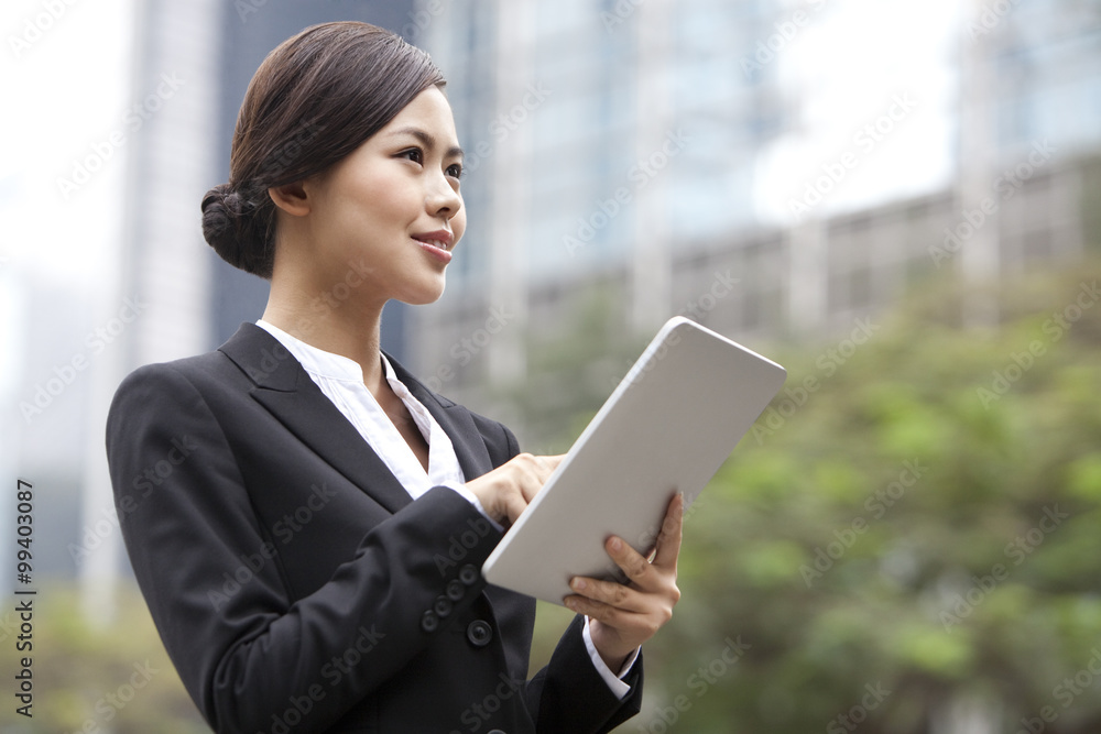 Professional businesswoman with digital tablet, Hong Kong Professional businesswoman with digital tablet, Hong Kong