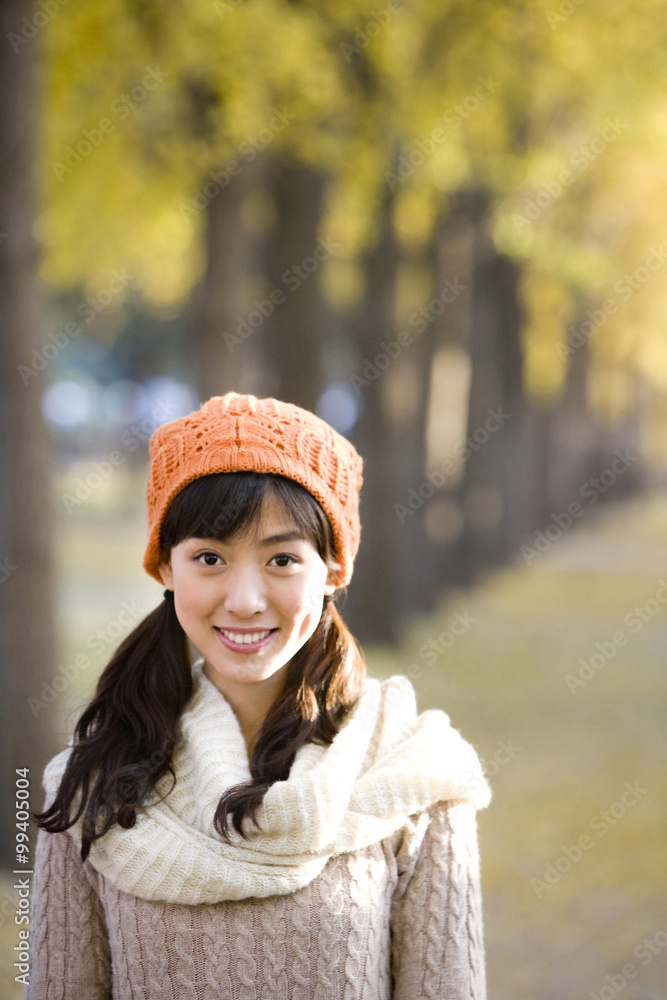 Young Woman in a Park in Autumn Young Woman in a Park in Autumn