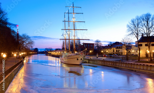 Ship-restaurant is docked on the Danes river quay. Early morning scene of Klaipeda old town district. Klaipeda, Lithuania. photo