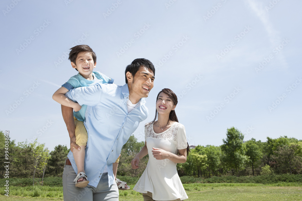 Young family playing outdoors