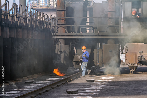 Work on the ceiling of the battery when charging coke oven with coal photo