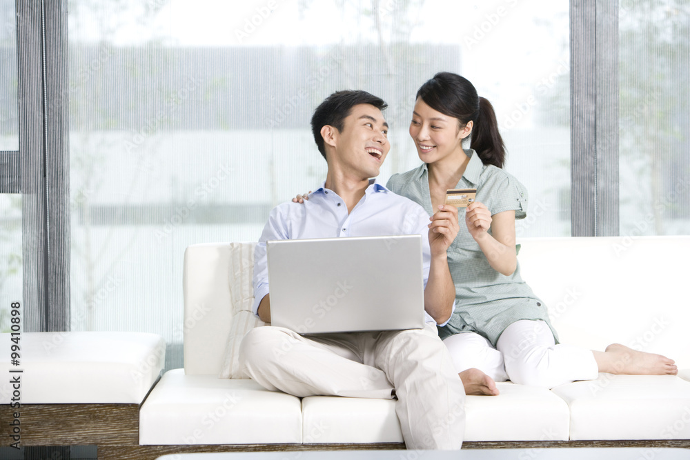 Portrait of a couple online shopping from home Portrait of a couple online shopping from home