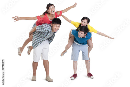 Studio shot of two young couples